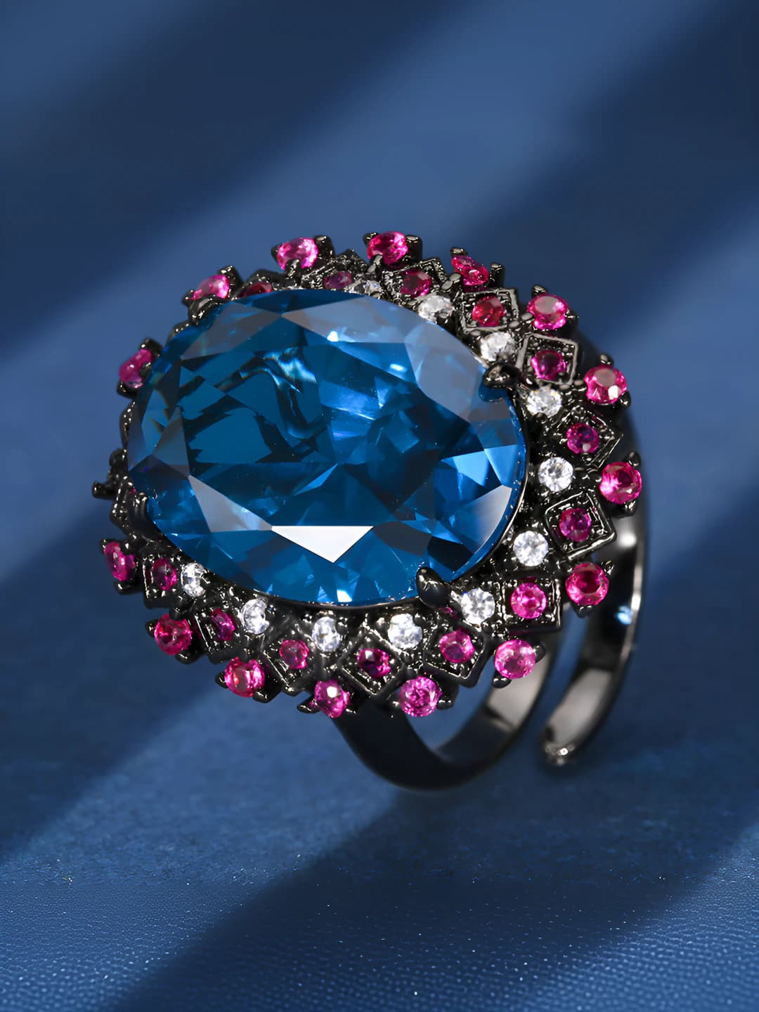 Black gold blue spinel ring