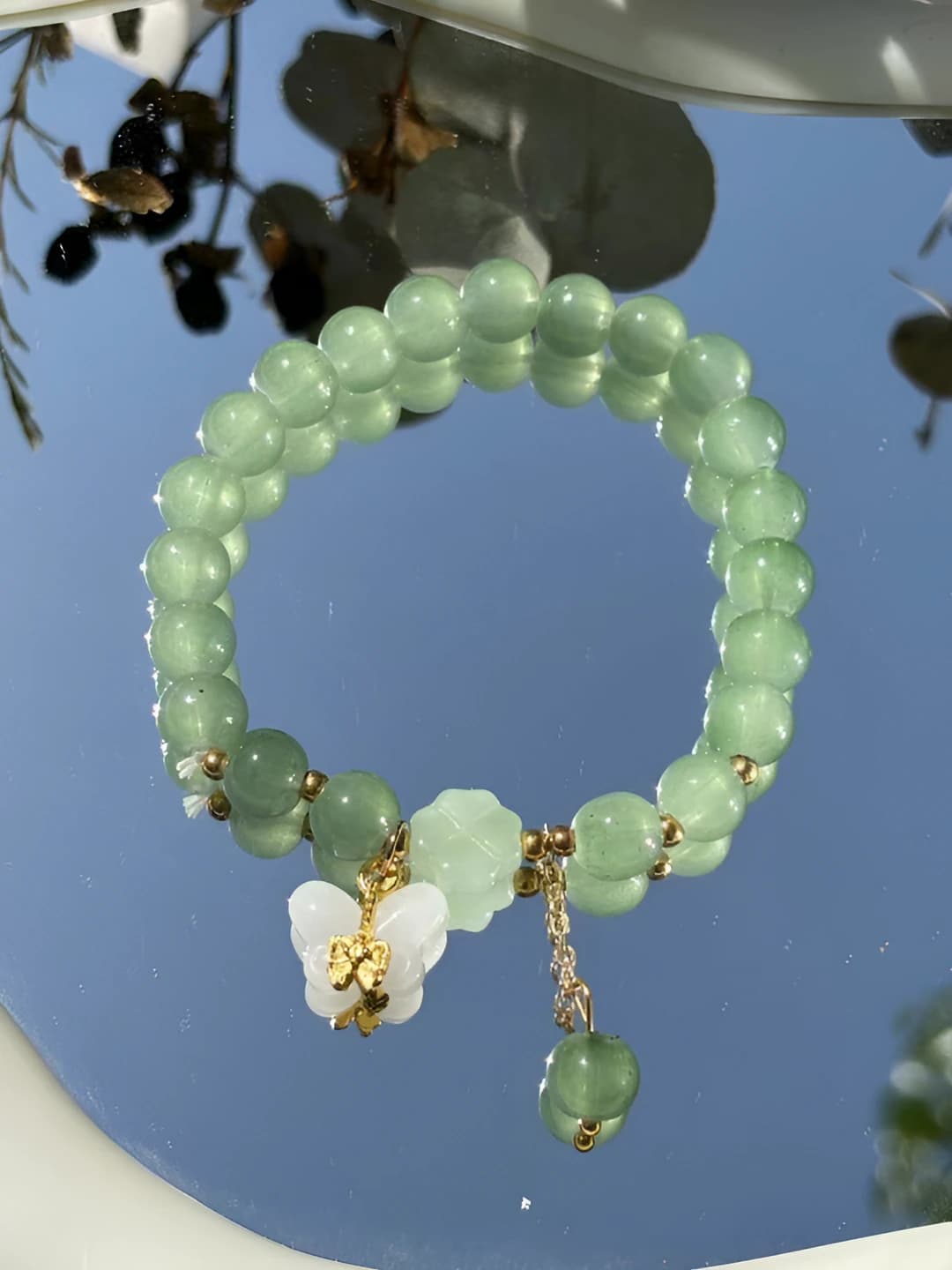 White butterfly, jade bracelet