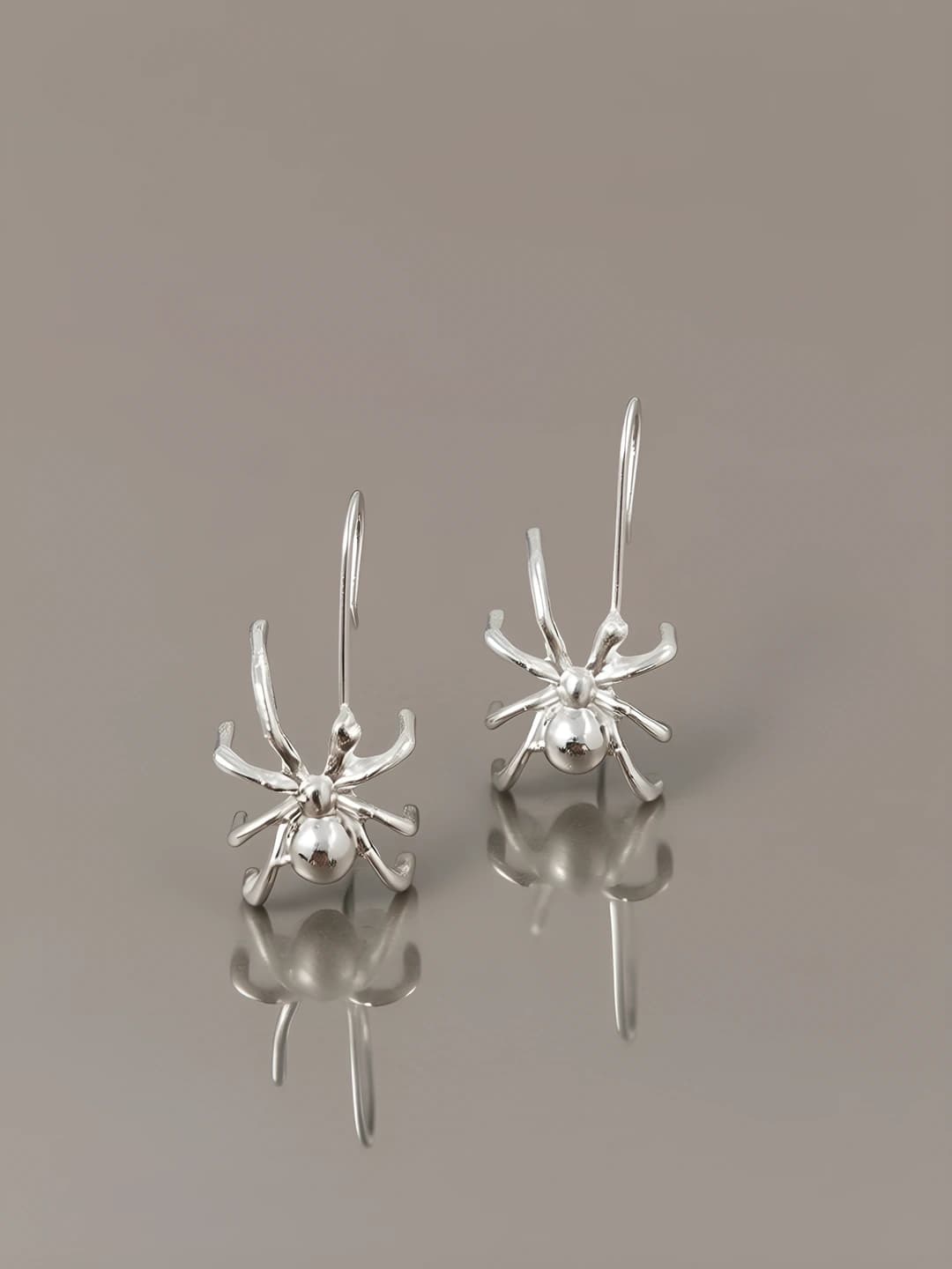 Silver spider earring