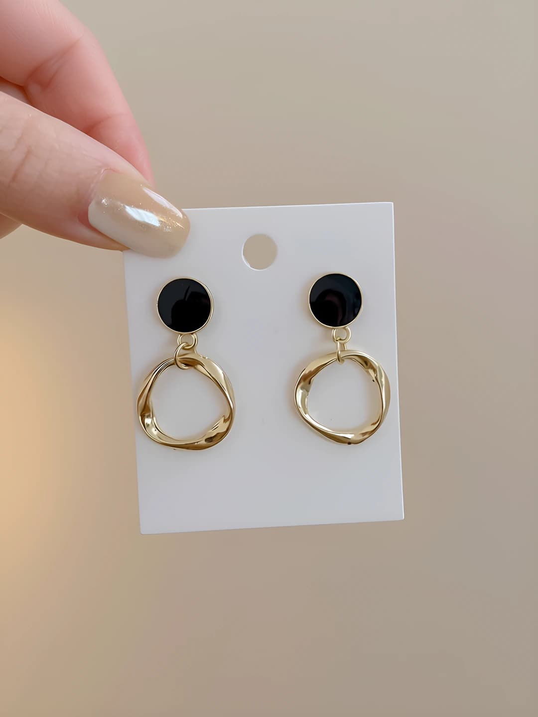 Black circle earrings, gold