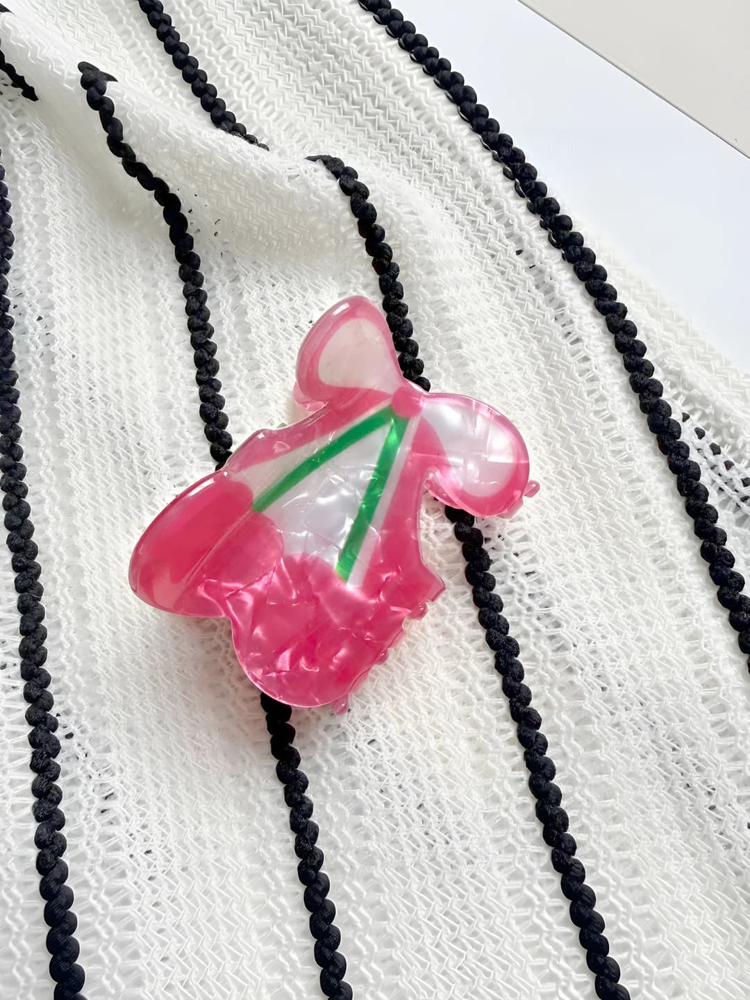 Pink bow and cherry