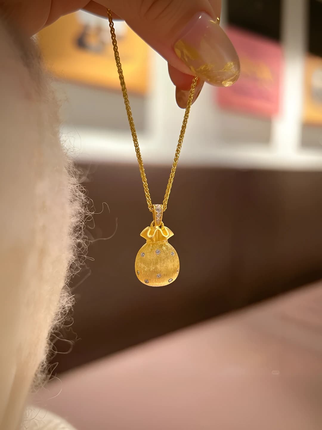 Gold small luck bag necklace