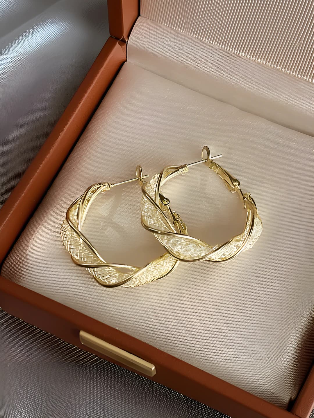 Gold twisted hoops