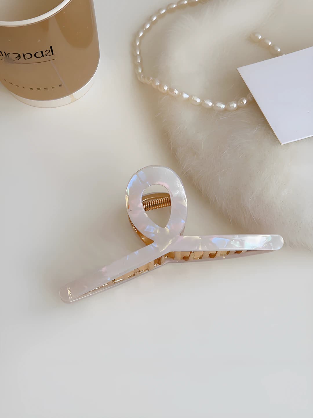 White, iridescent, bow clip