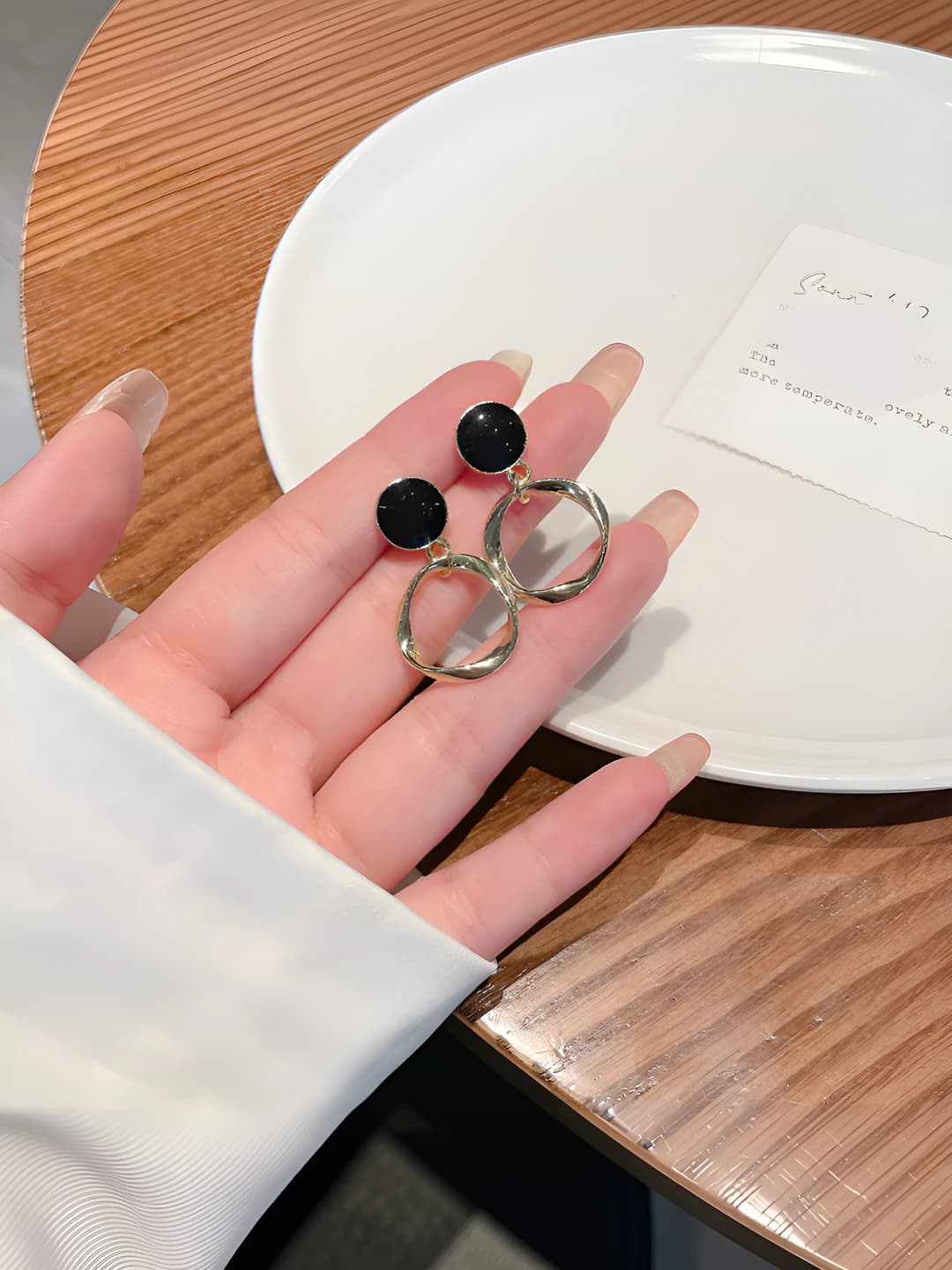 Black circle earrings, gold