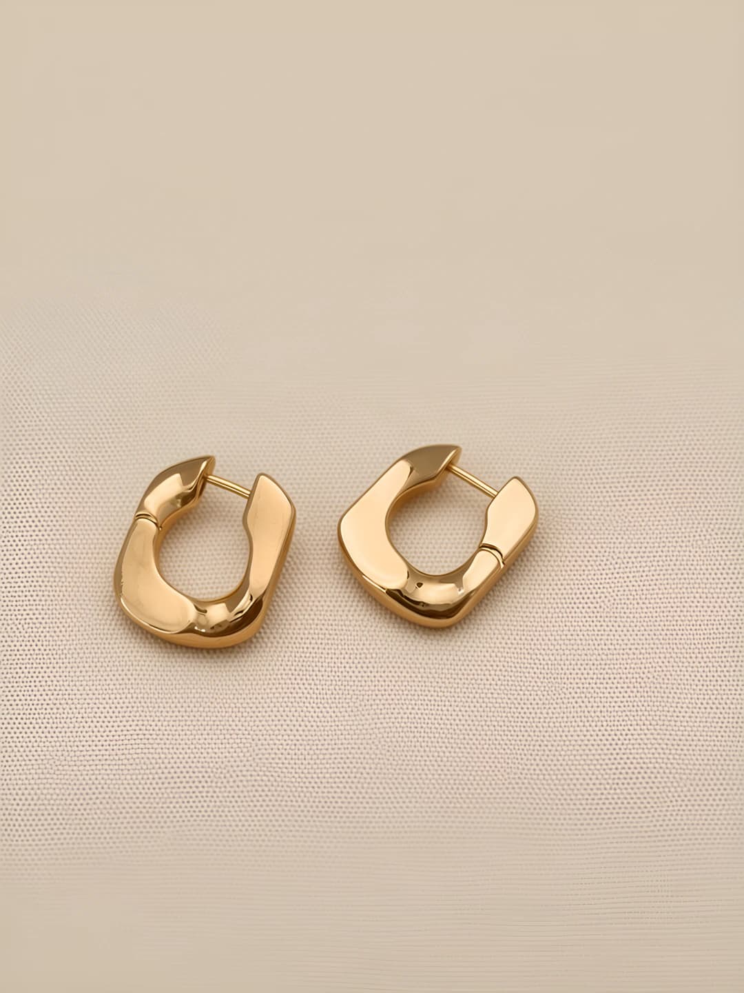 Gold U-shaped earrings