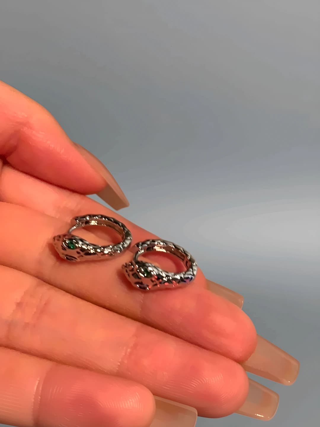 Green-eyed snake ear cuff