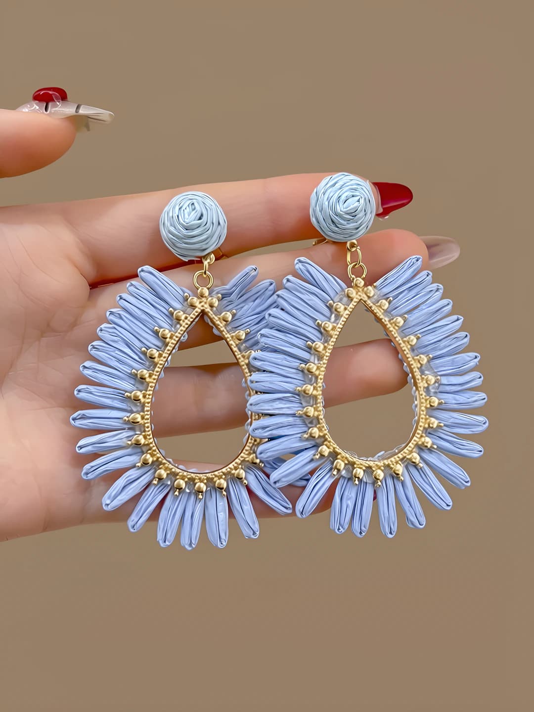 Blue openwork straw studs