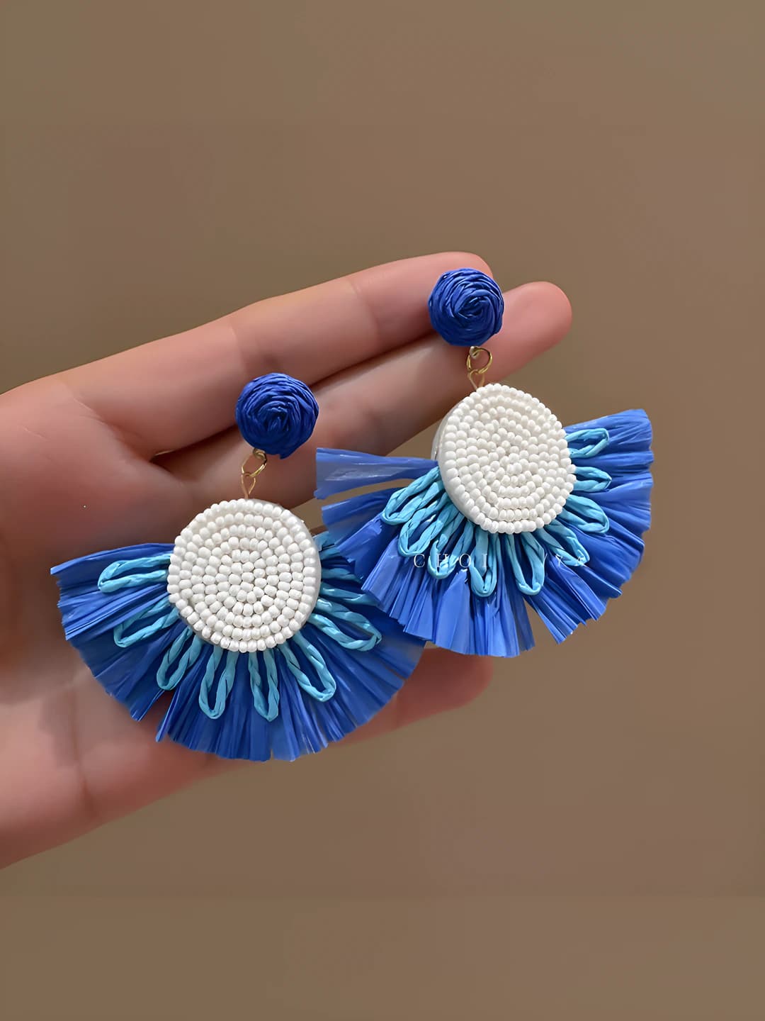 Blue grass-woven skirt stud earrings