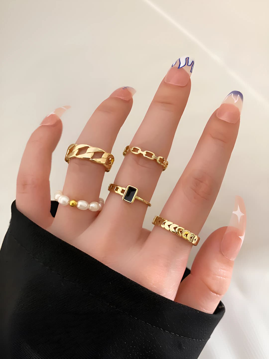Women's pearl and heart-shaped ring set, design element in cold style