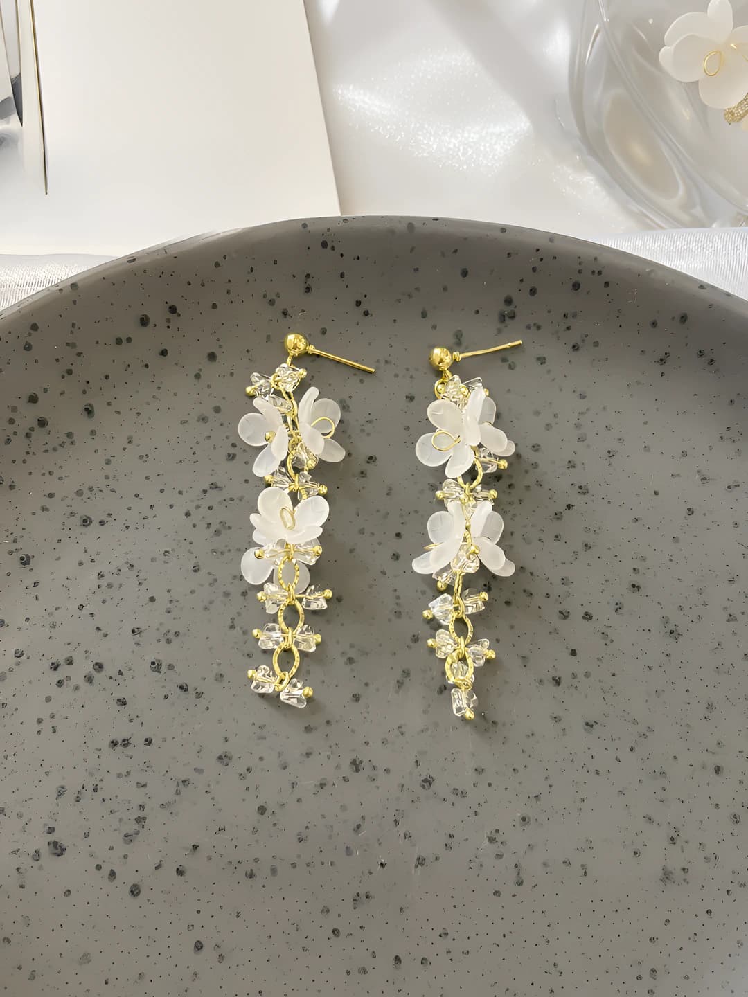 White flower, gold chain, earrings