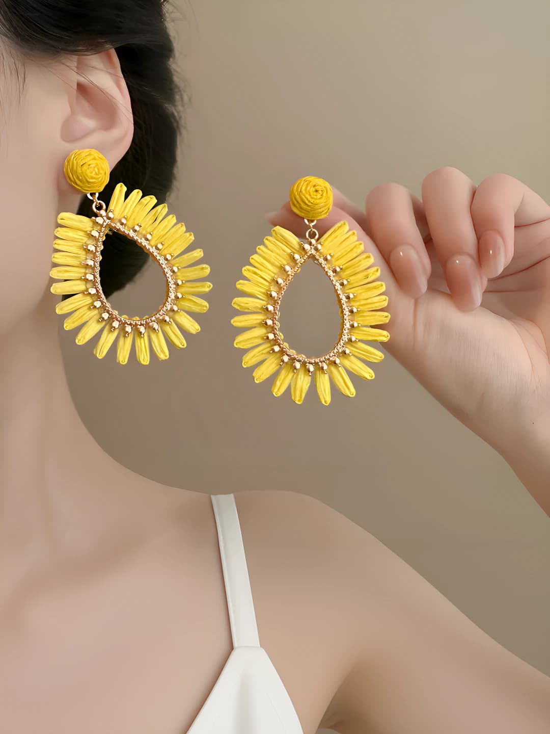 Yellow openwork woven stud earrings