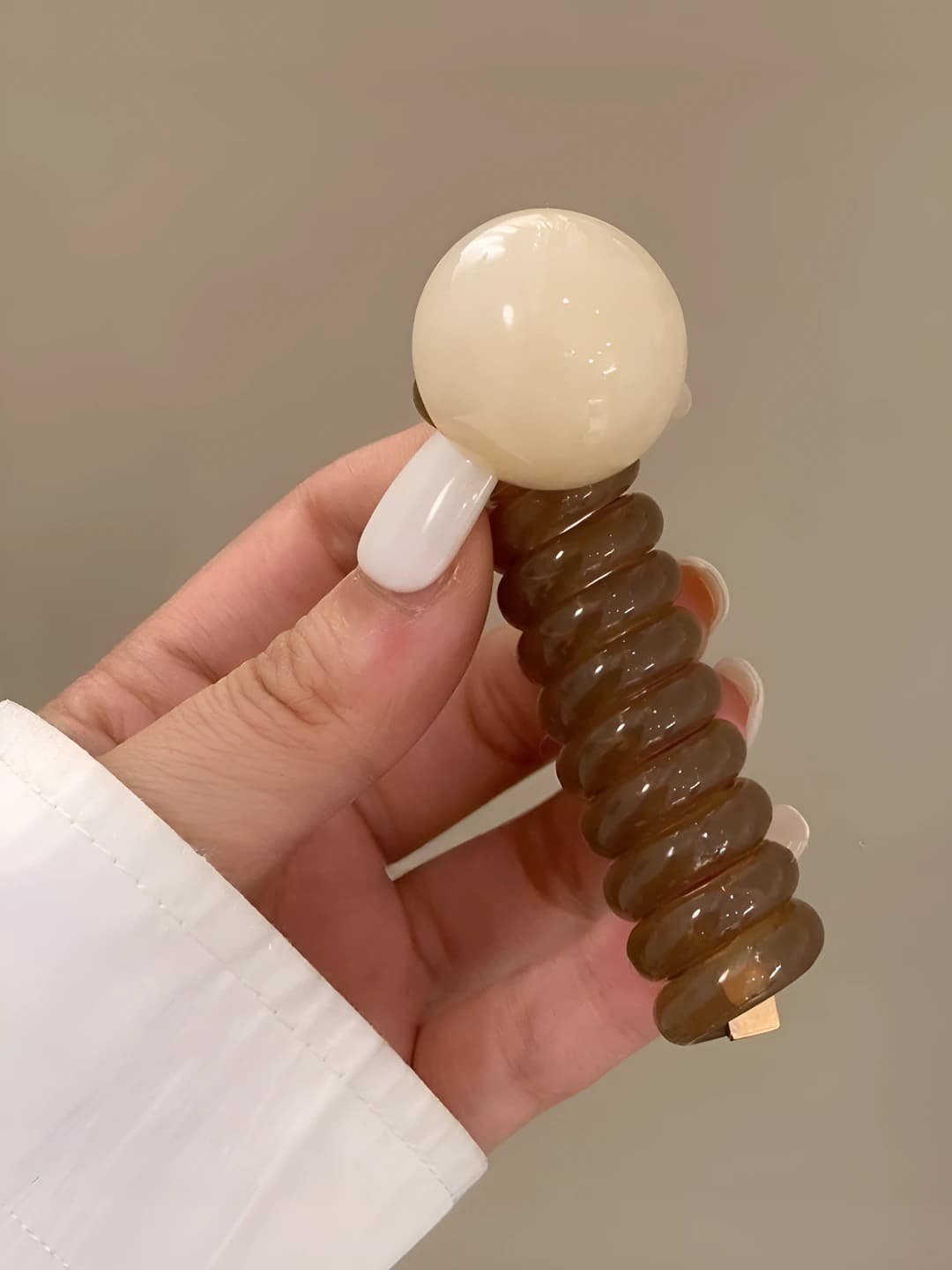 Off-white beads, light coffee cord