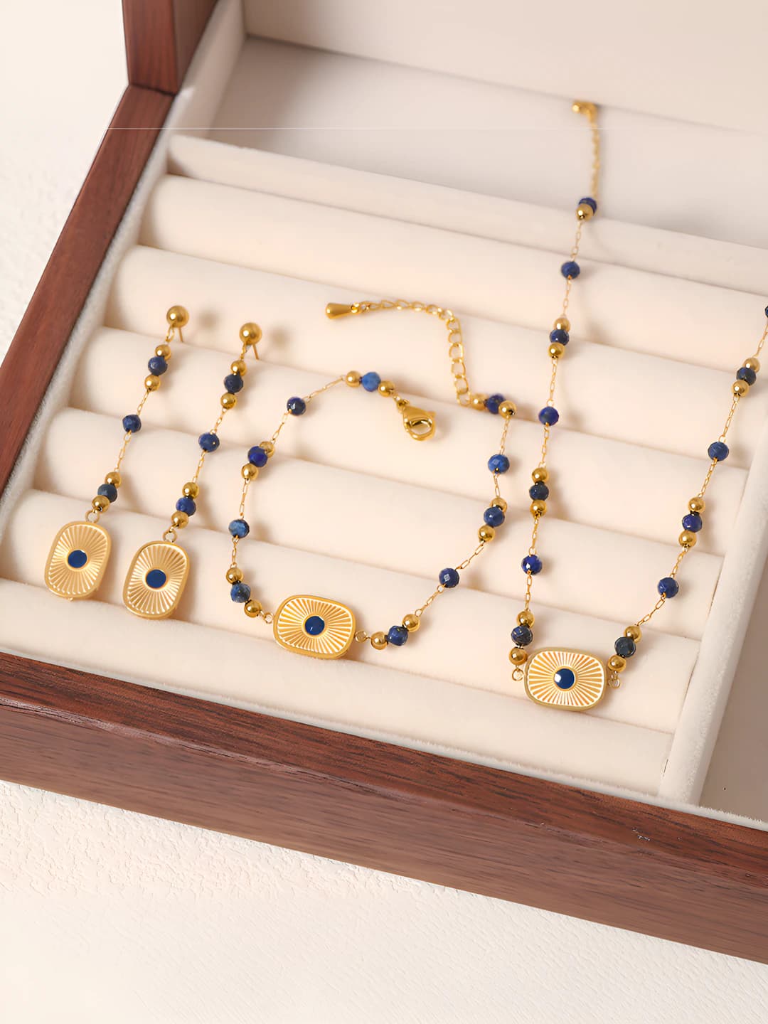 Women's jewelry set: titanium steel bracelet, long drop earrings and necklace with 18K gold plating