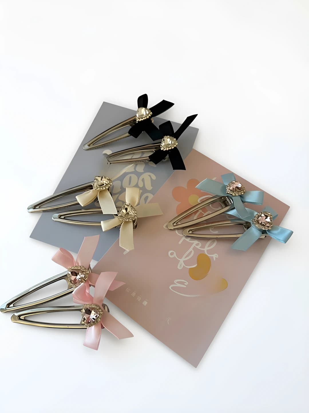 Women's hair clips and combs: cream ribbon bow with rhinestones and heart details