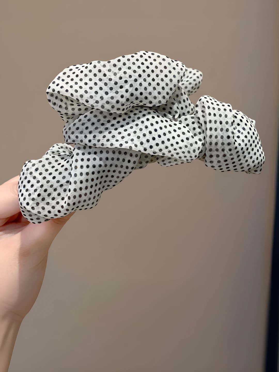 White polka dot clip