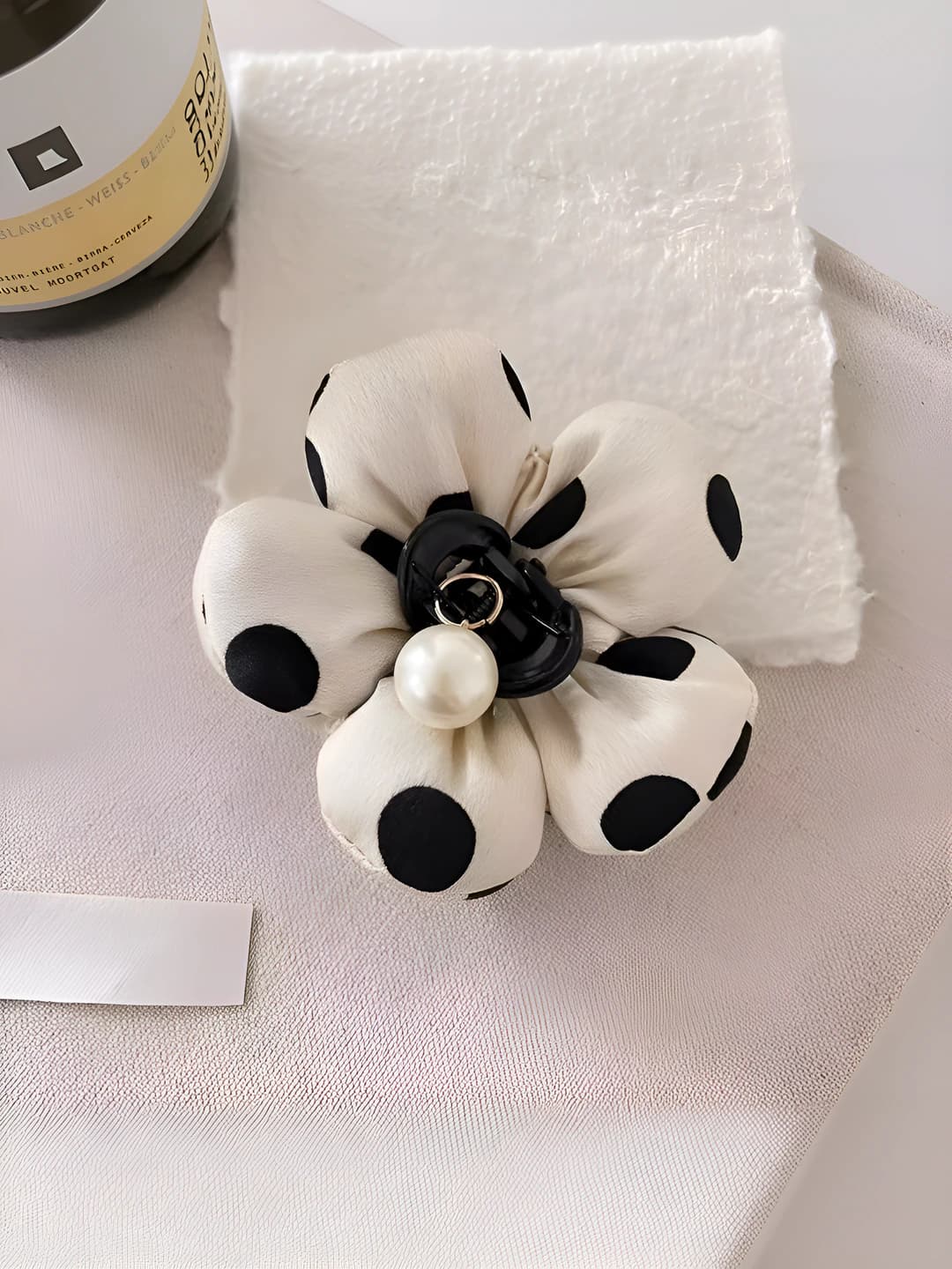 White polka dot hair clip