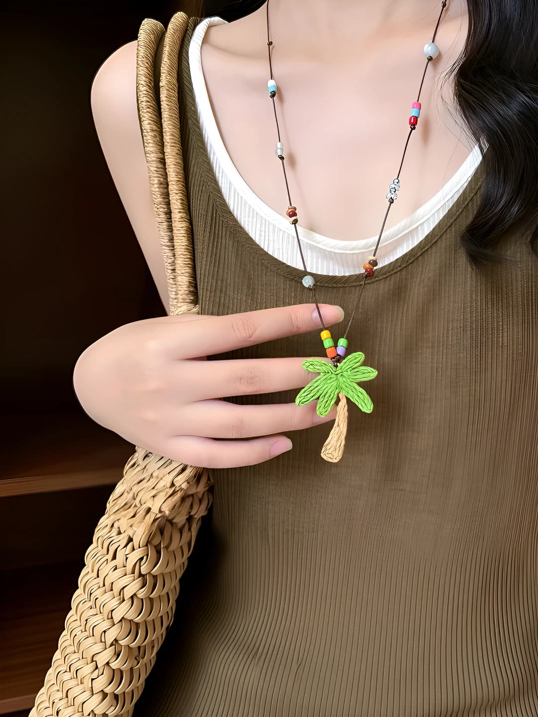Women's beaded necklace with woven coconut tree pendant