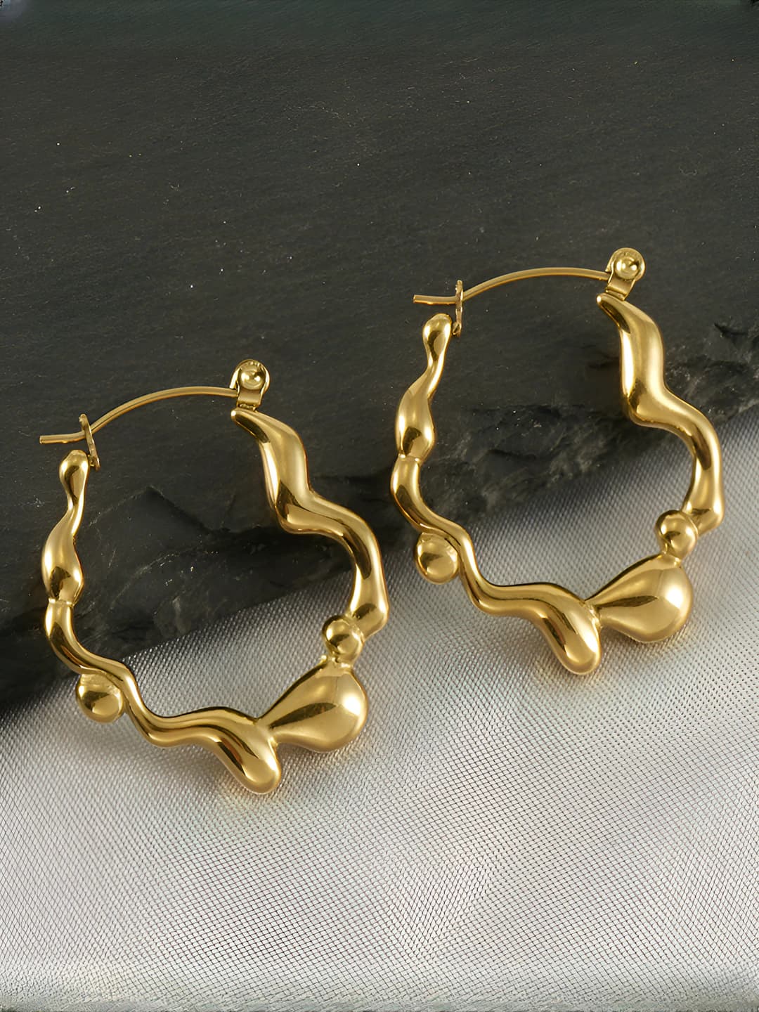 Women's gold titanium steel earrings with irregular design