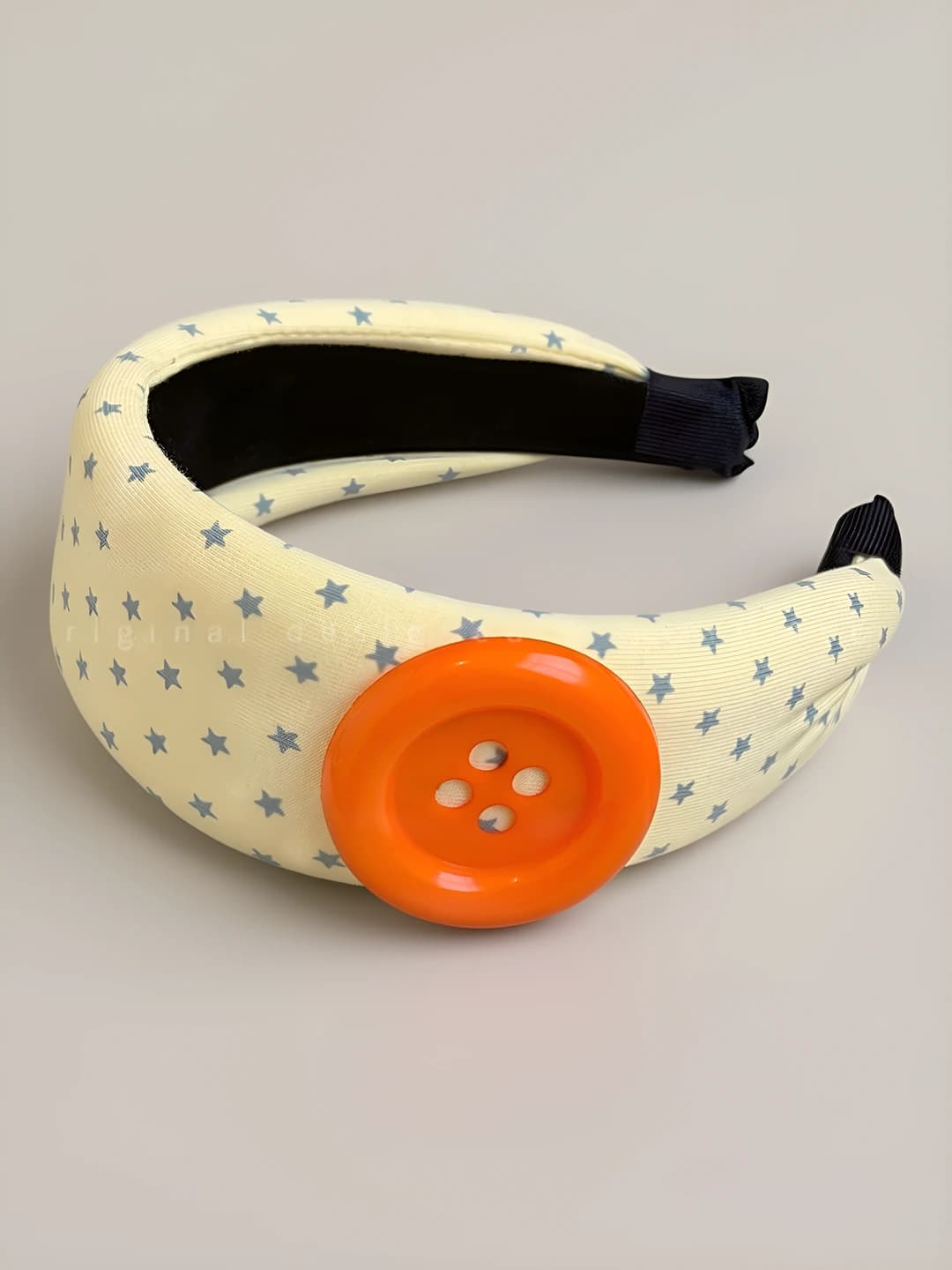 Orange button yellow headband