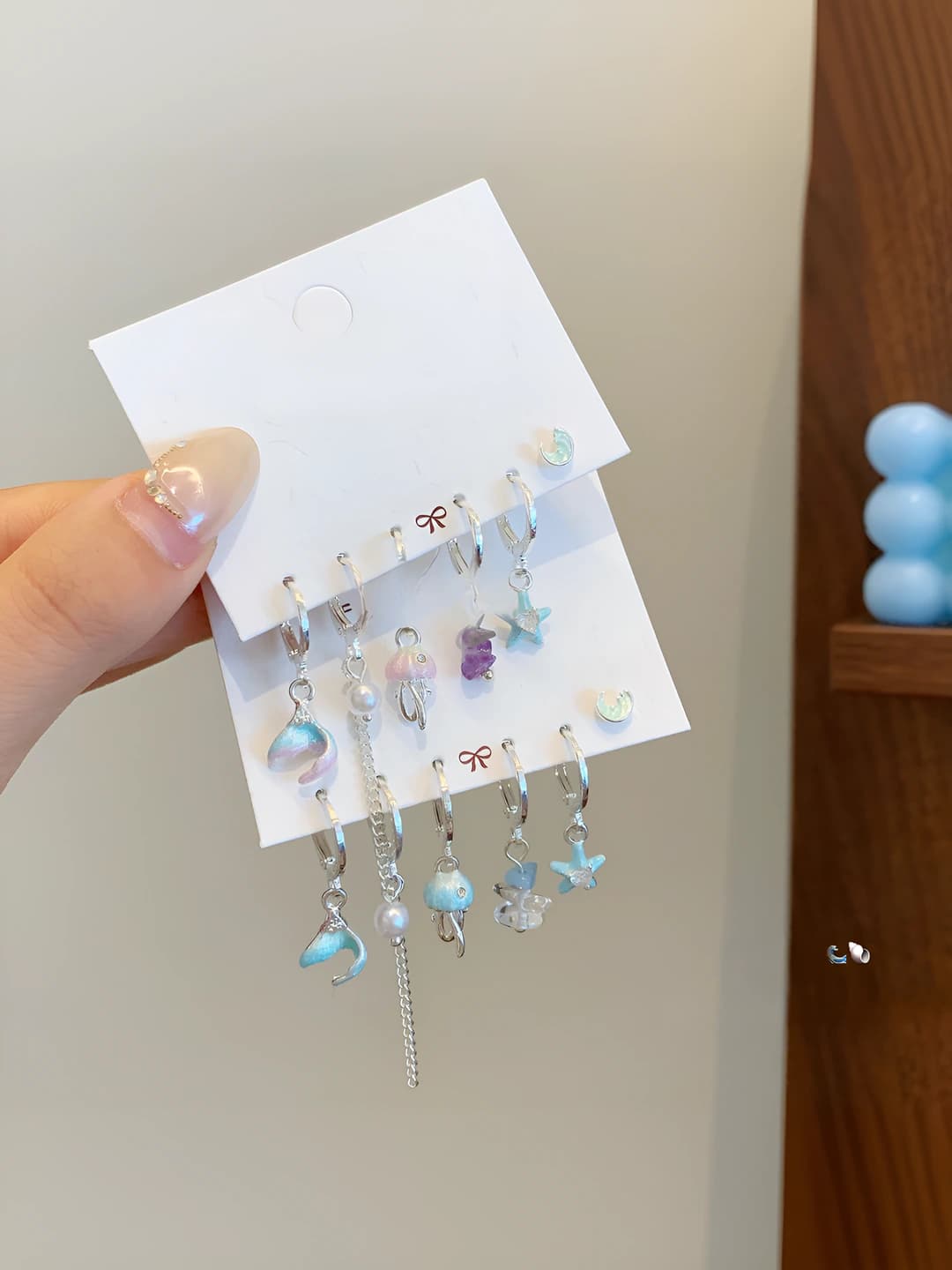 Women's ocean-themed earring set with jellyfish, star and fish shapes, pearl and moon design elements, sweet style