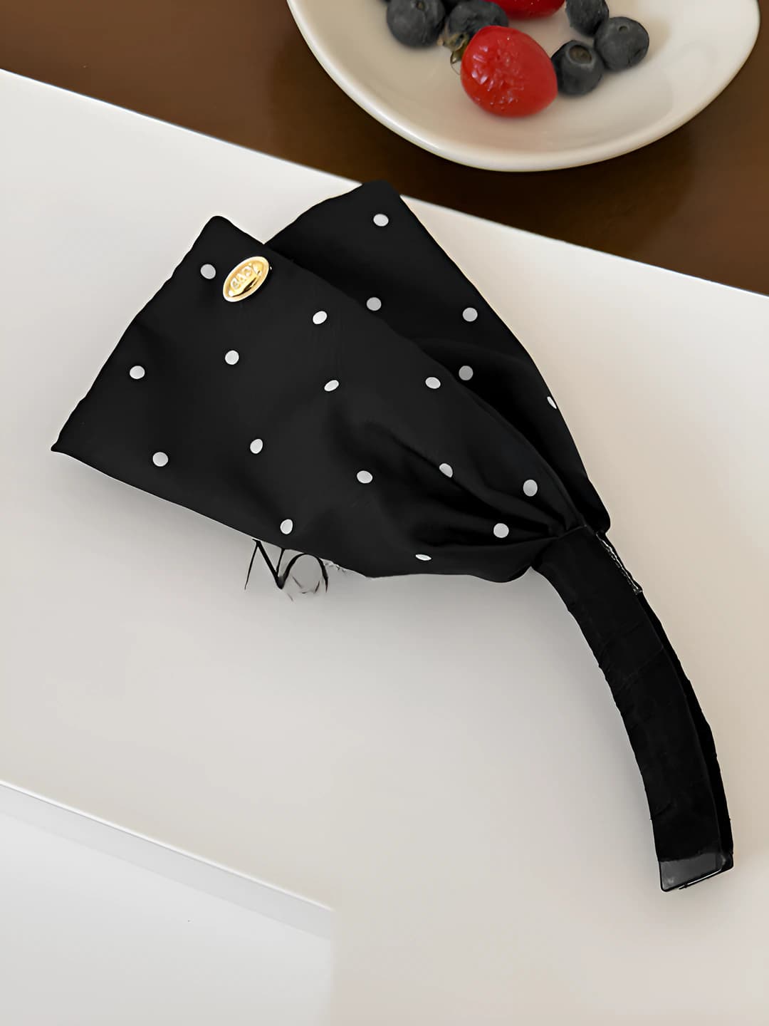 Black polka dot banana clip