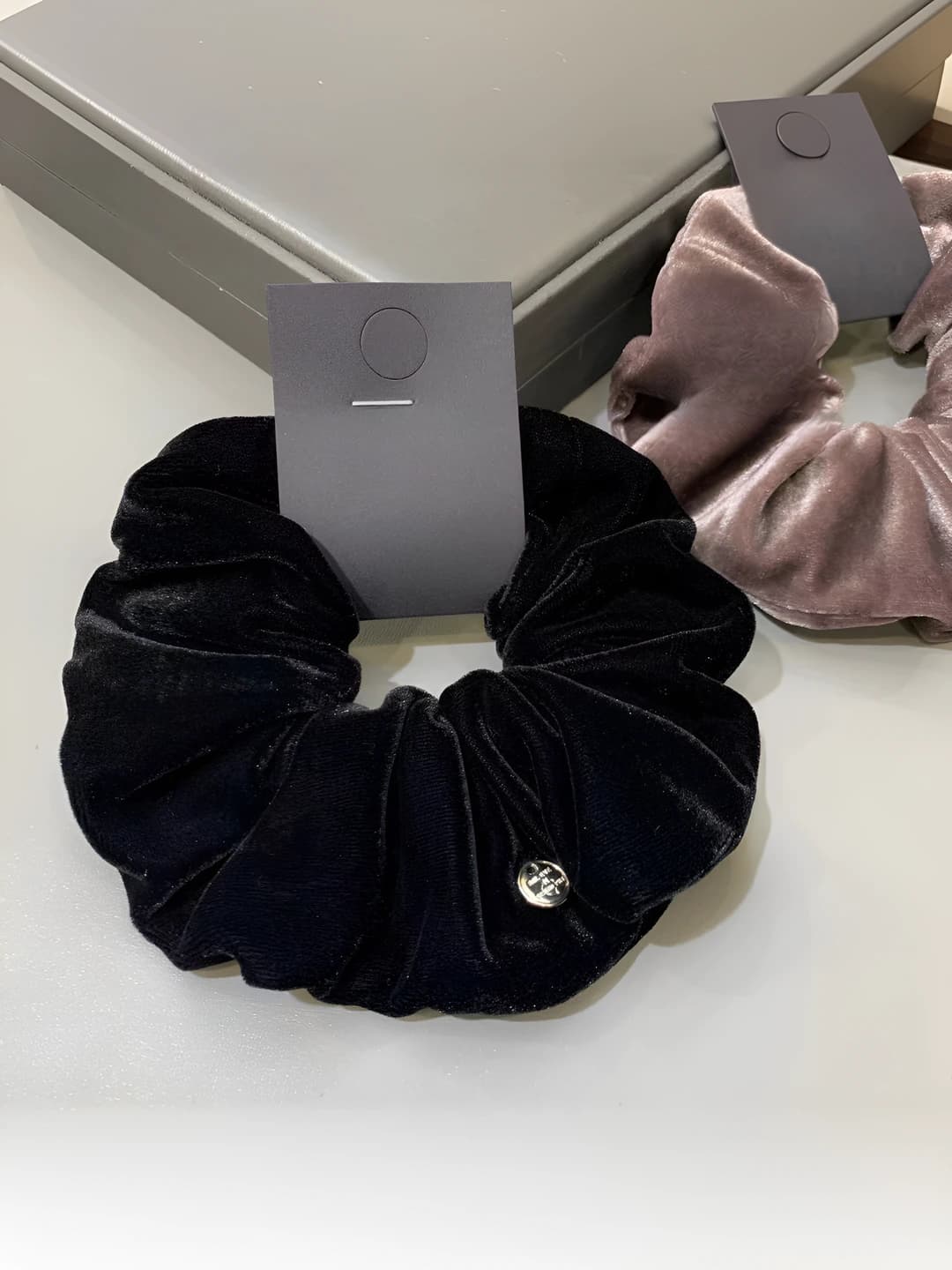 Women's velvet hair tie in retro style with metal logo