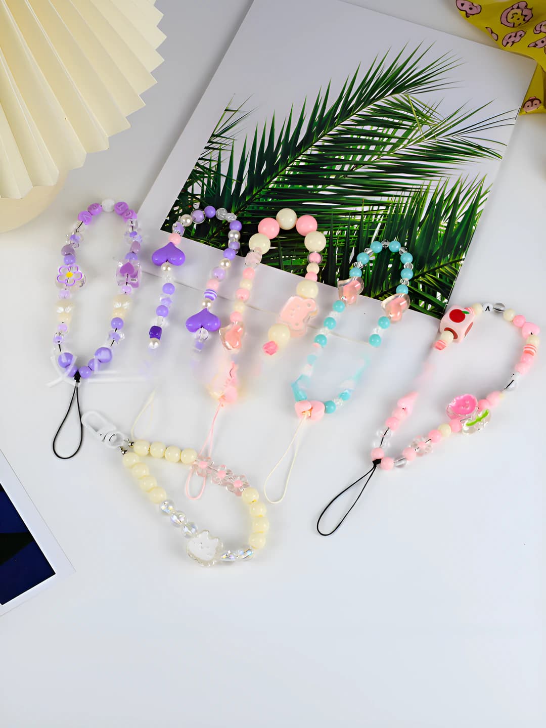 Women's beaded phone chain with pink sakura pattern, mini animal figures, tulip design element, made of plastic
