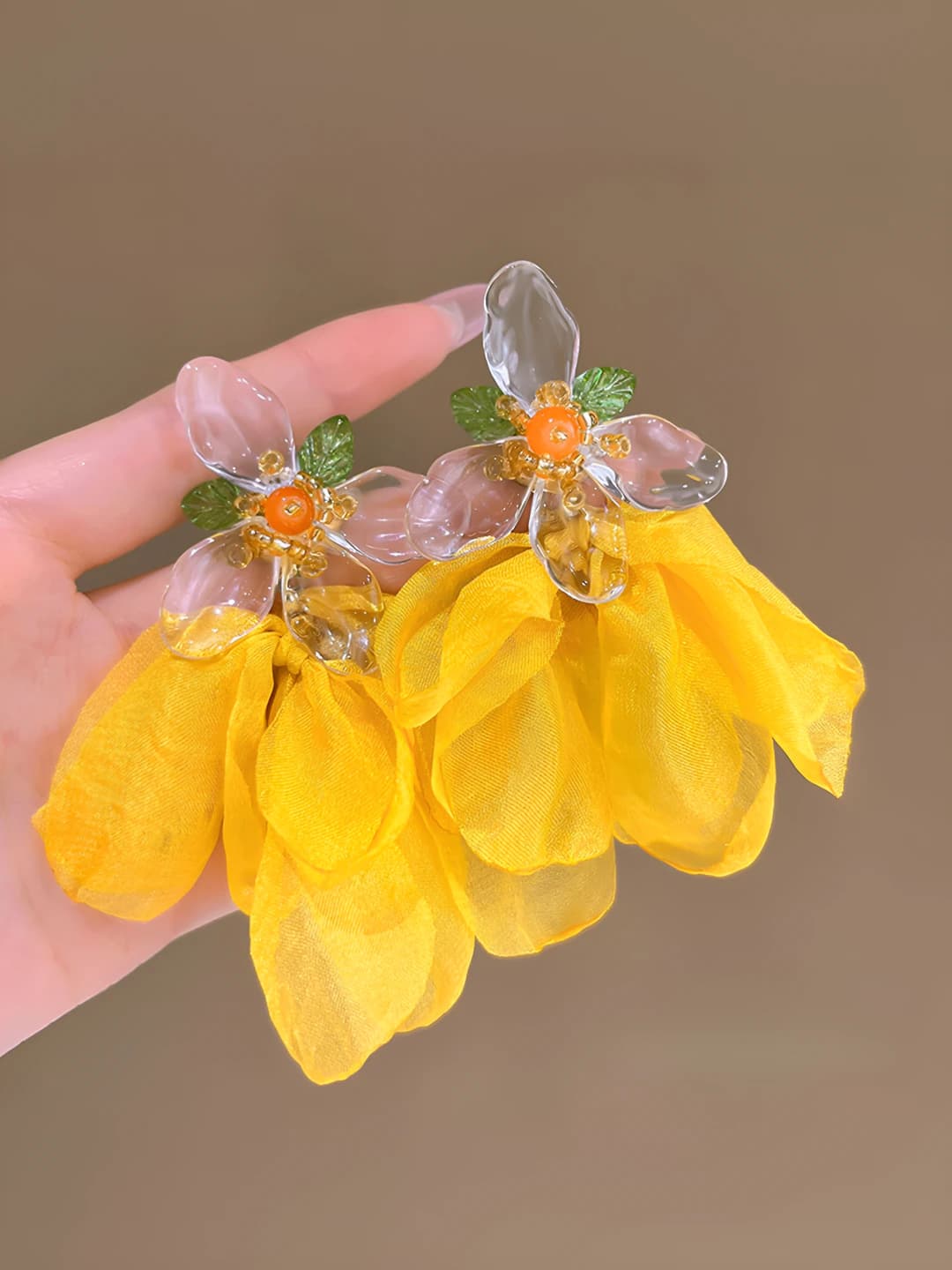 Yellow mesh flower clip-on earrings