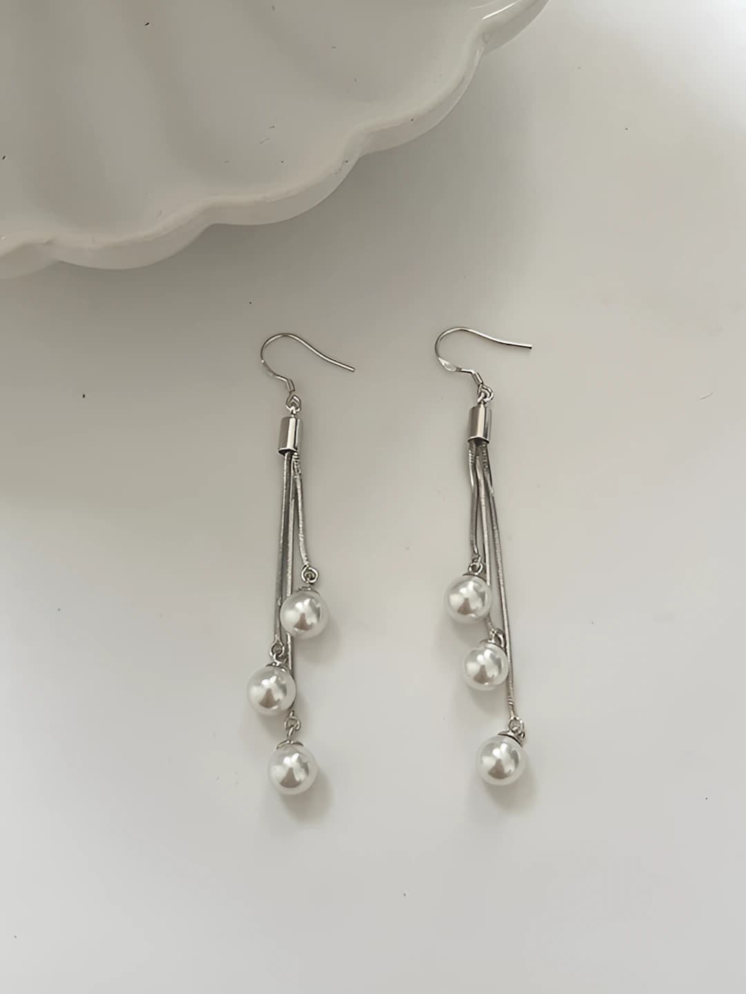 Women's pearl drop earrings with bow in natural style, delicate and sweet design for autumn-winter