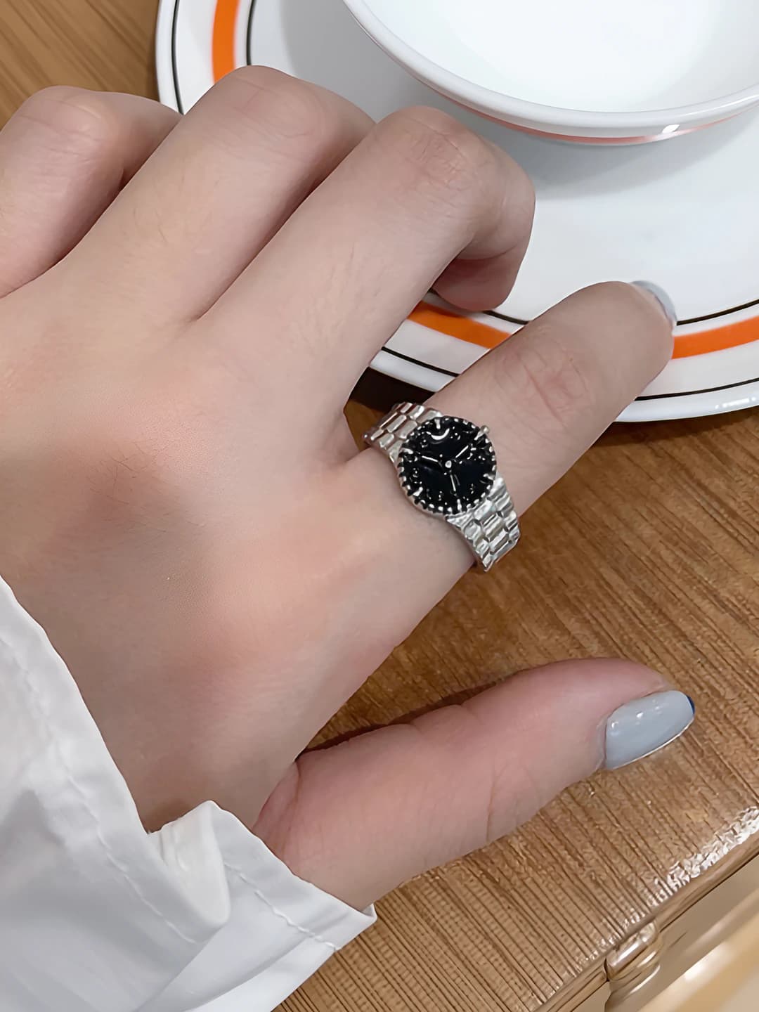 Women's ring with watch design and geometric shape