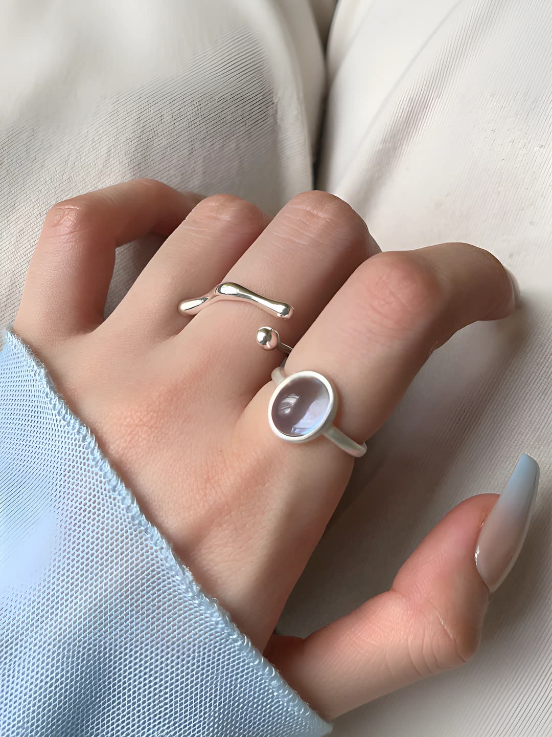Women's ring with oval zircon, geometric design element, open design