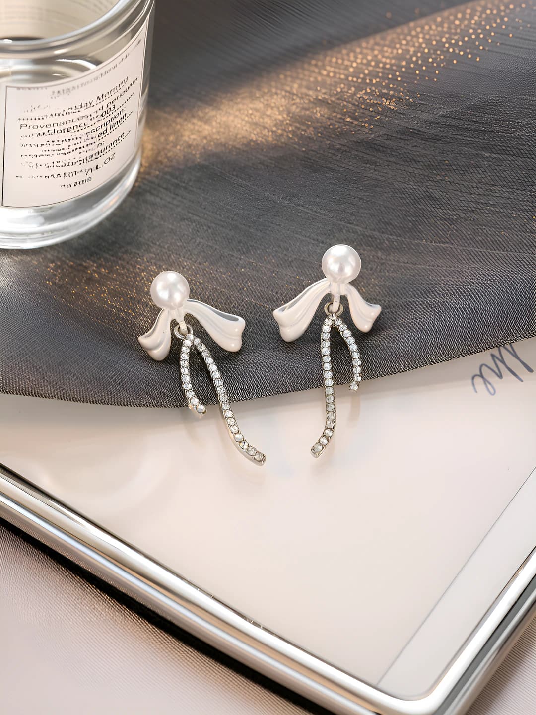 Women's 2026 light luxury pearl earrings with music note design element, small butterfly shape