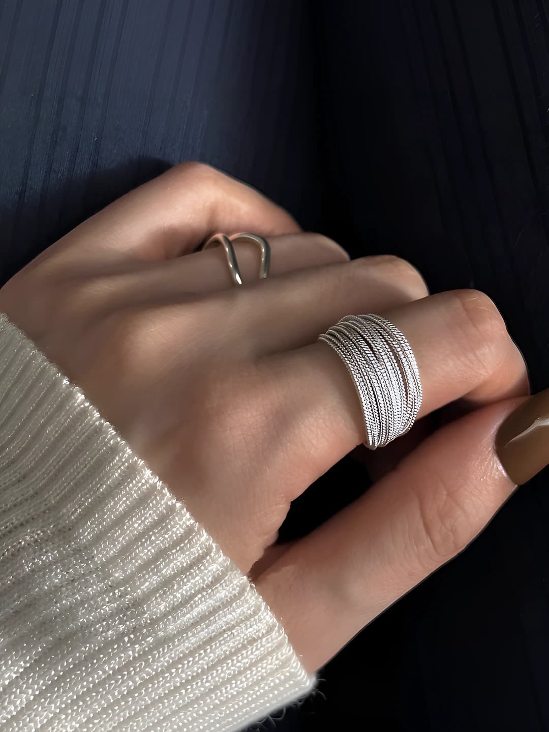 Women's stacked wire ring with geometric design, adjustable bands, and rhinestone inlays