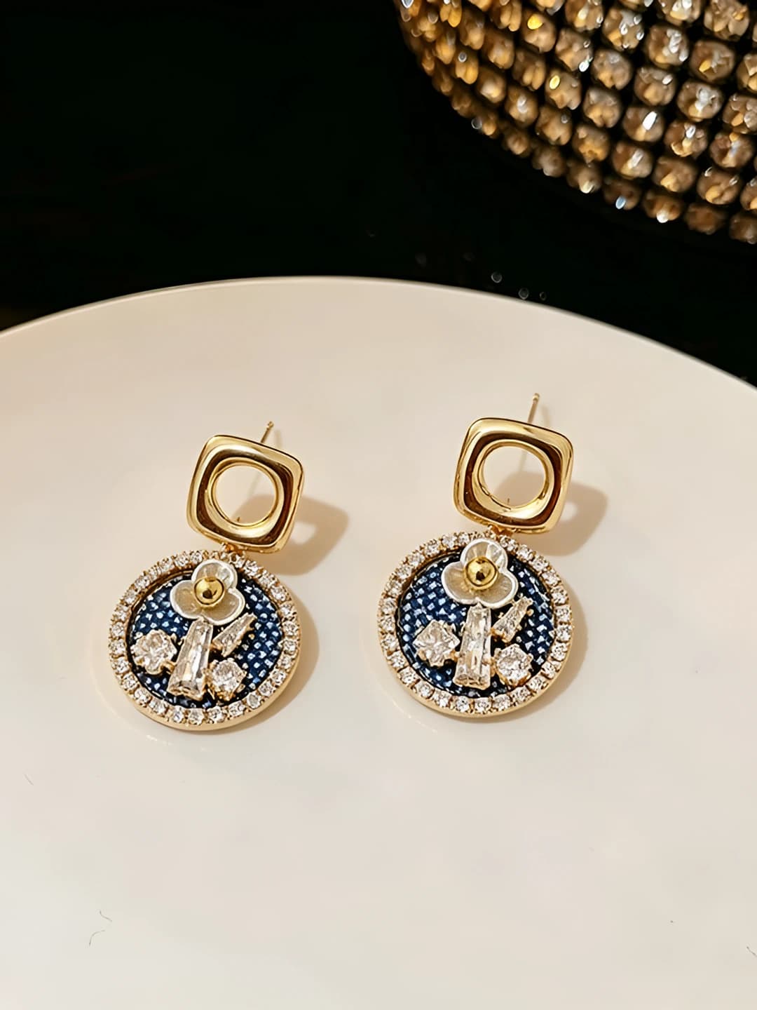 Gold rim blue diamond flower studs