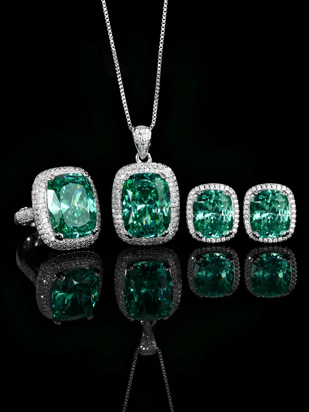 Women's gold-plated brass jewelry set: bracelet, pendant necklace, and earrings with green paraiba stone