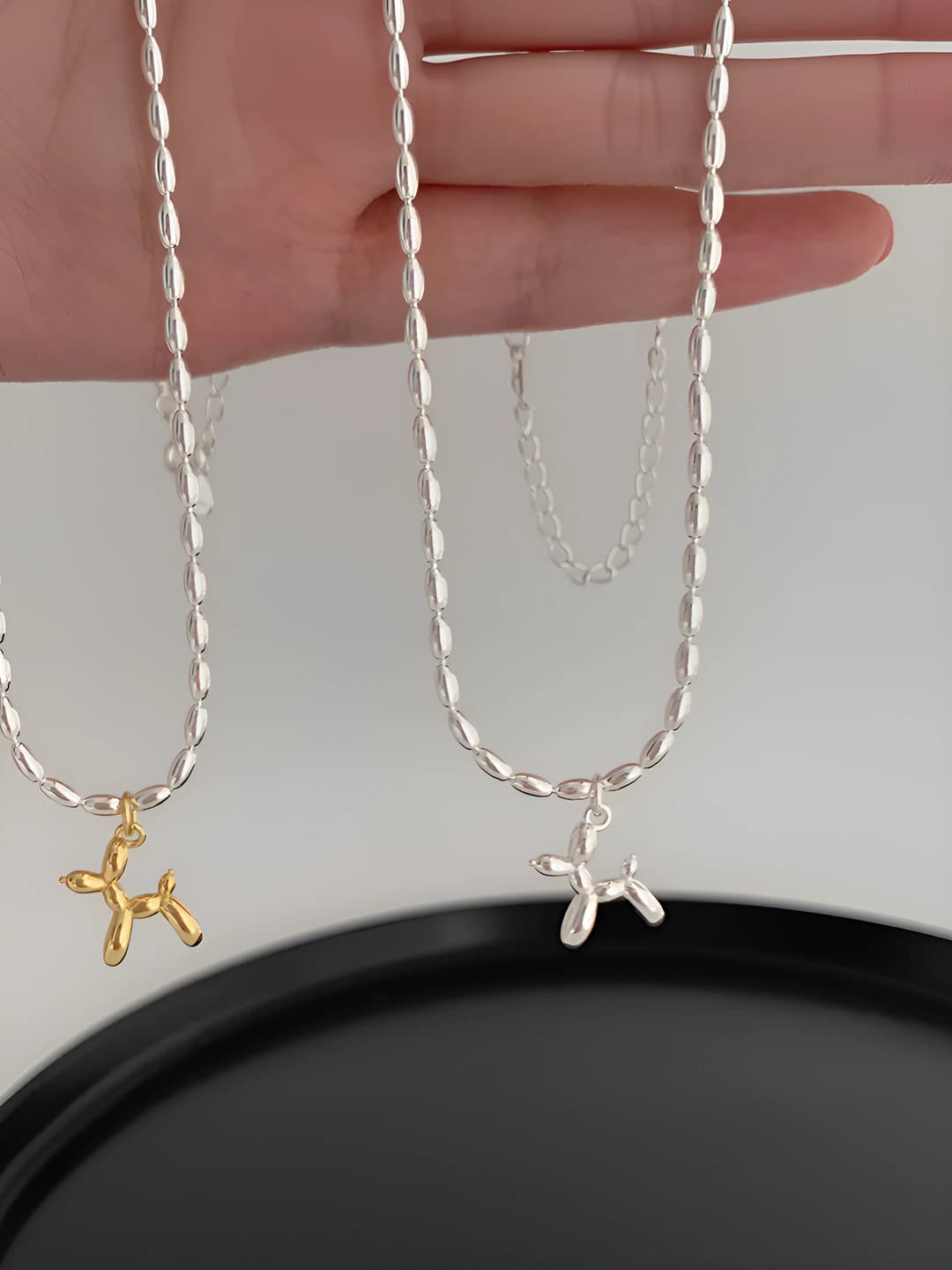Women's short pendant chain necklace with geometric shape and balloon dog design