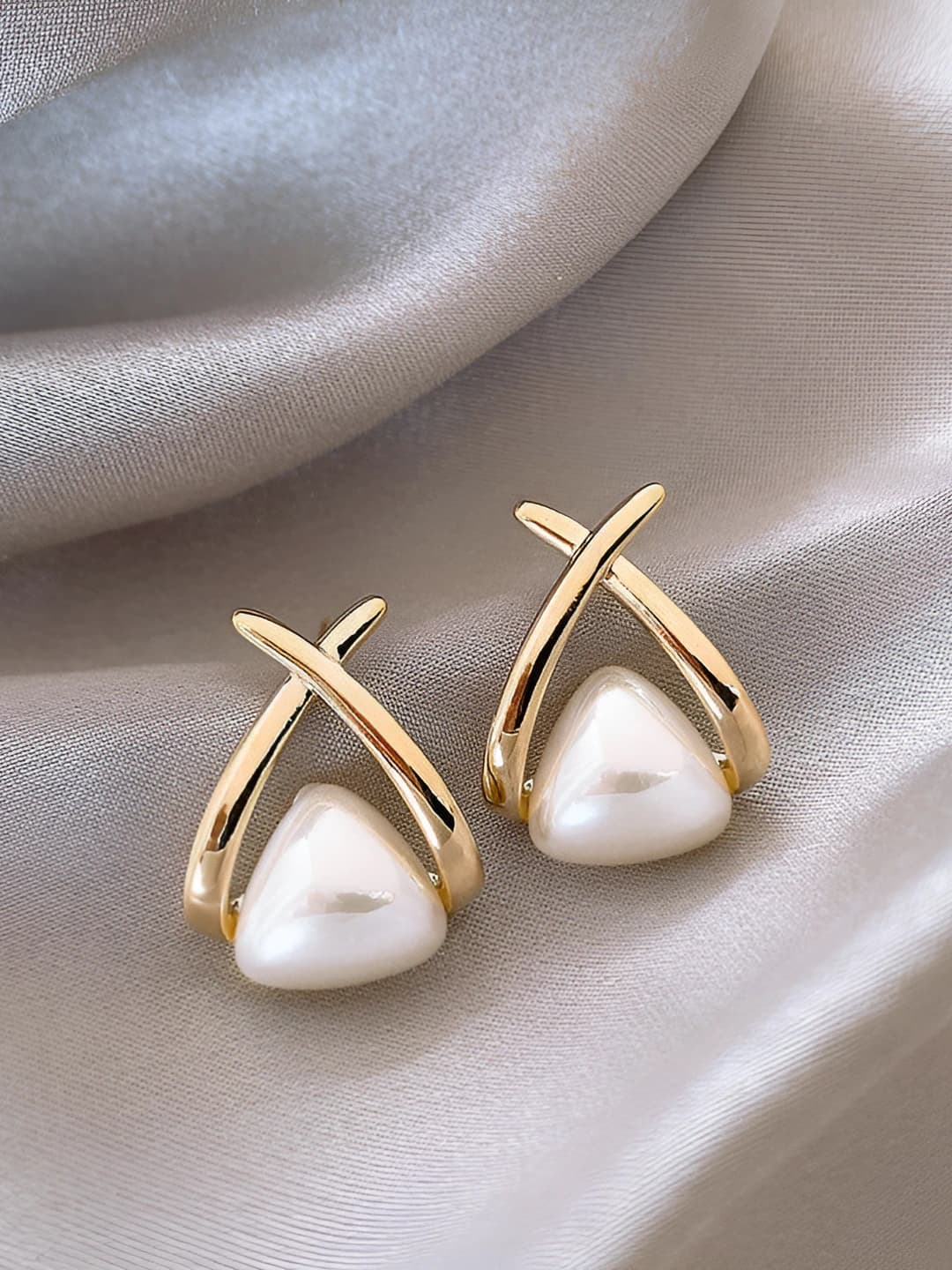 Crossed pearl ear clips