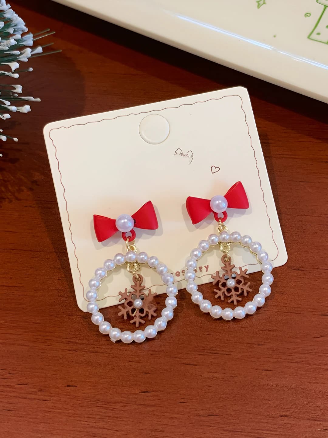 Red bowtie snowflake earrings