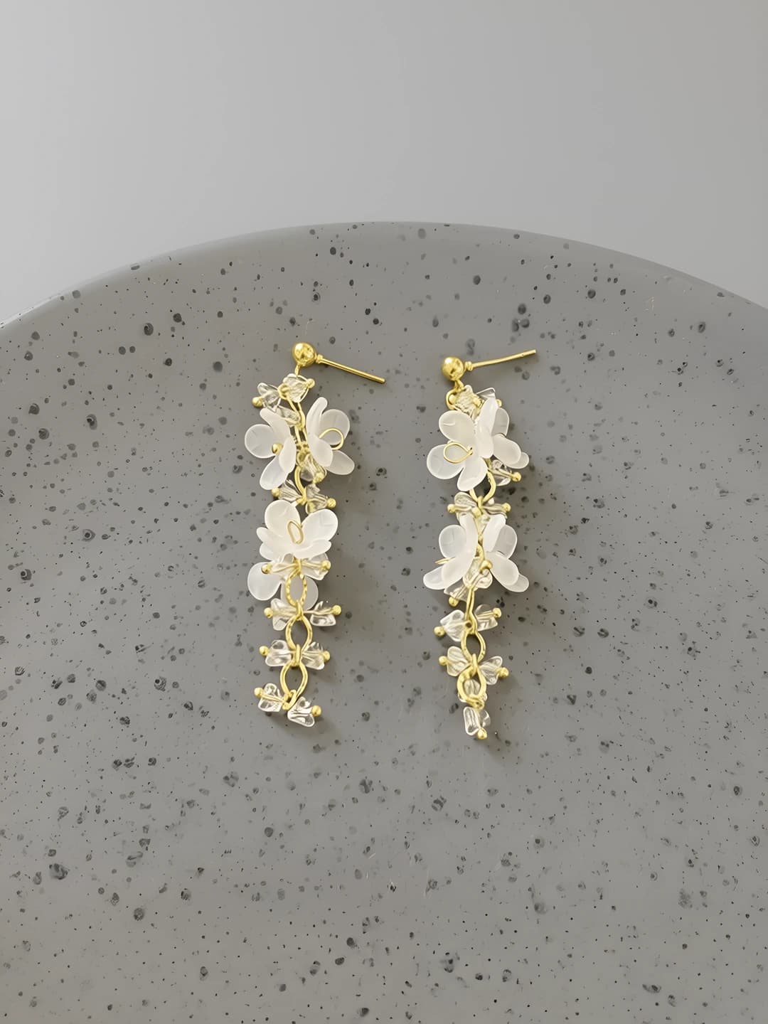 White flower, gold chain, earrings