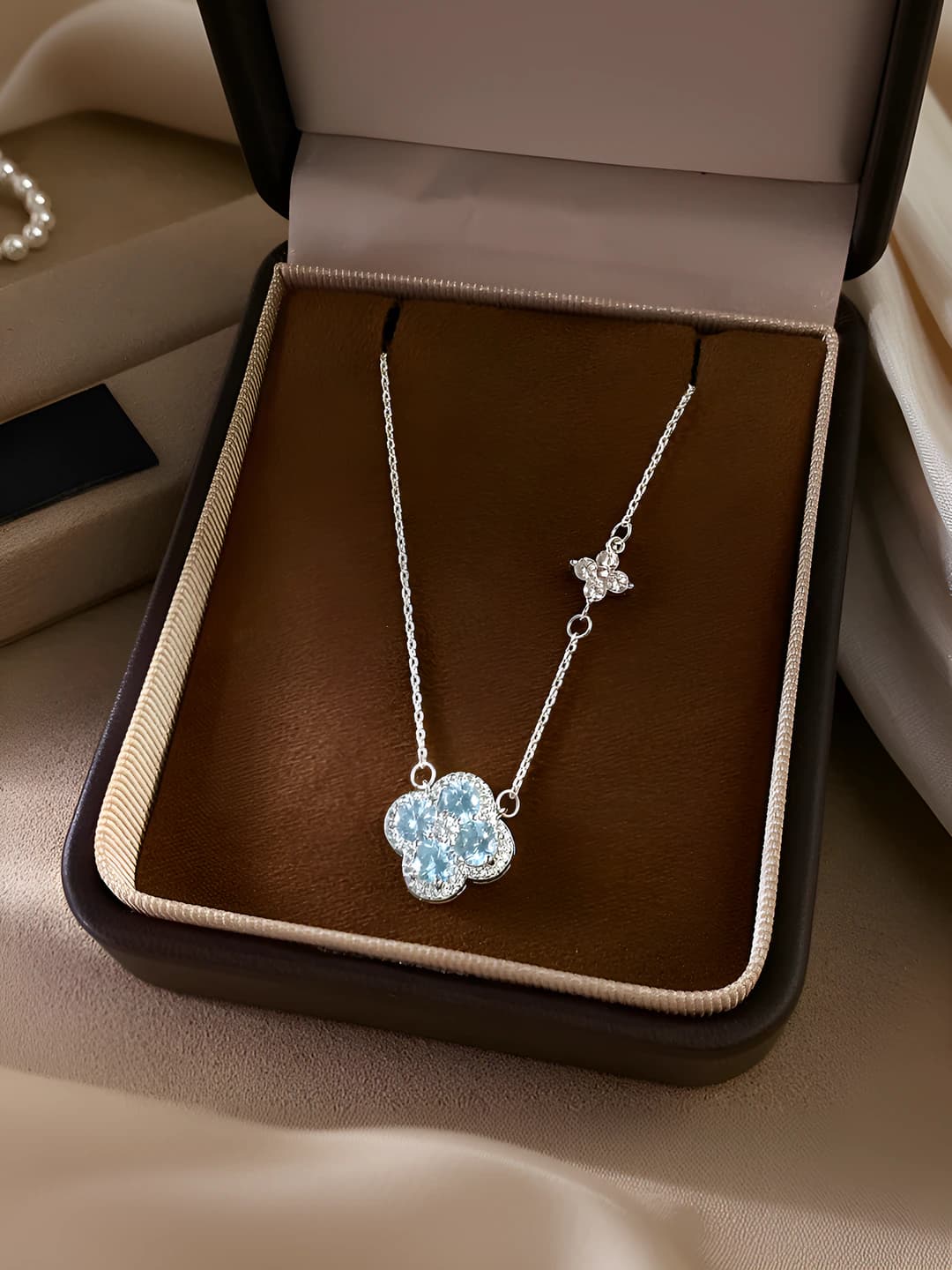Blue four-leaf flower necklace