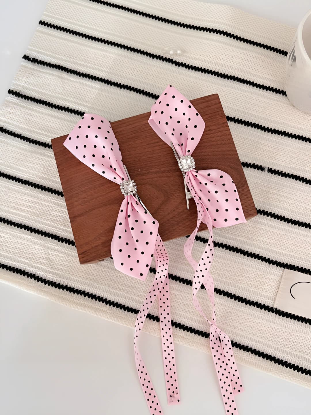 Pink polka dot ribbon clip pair