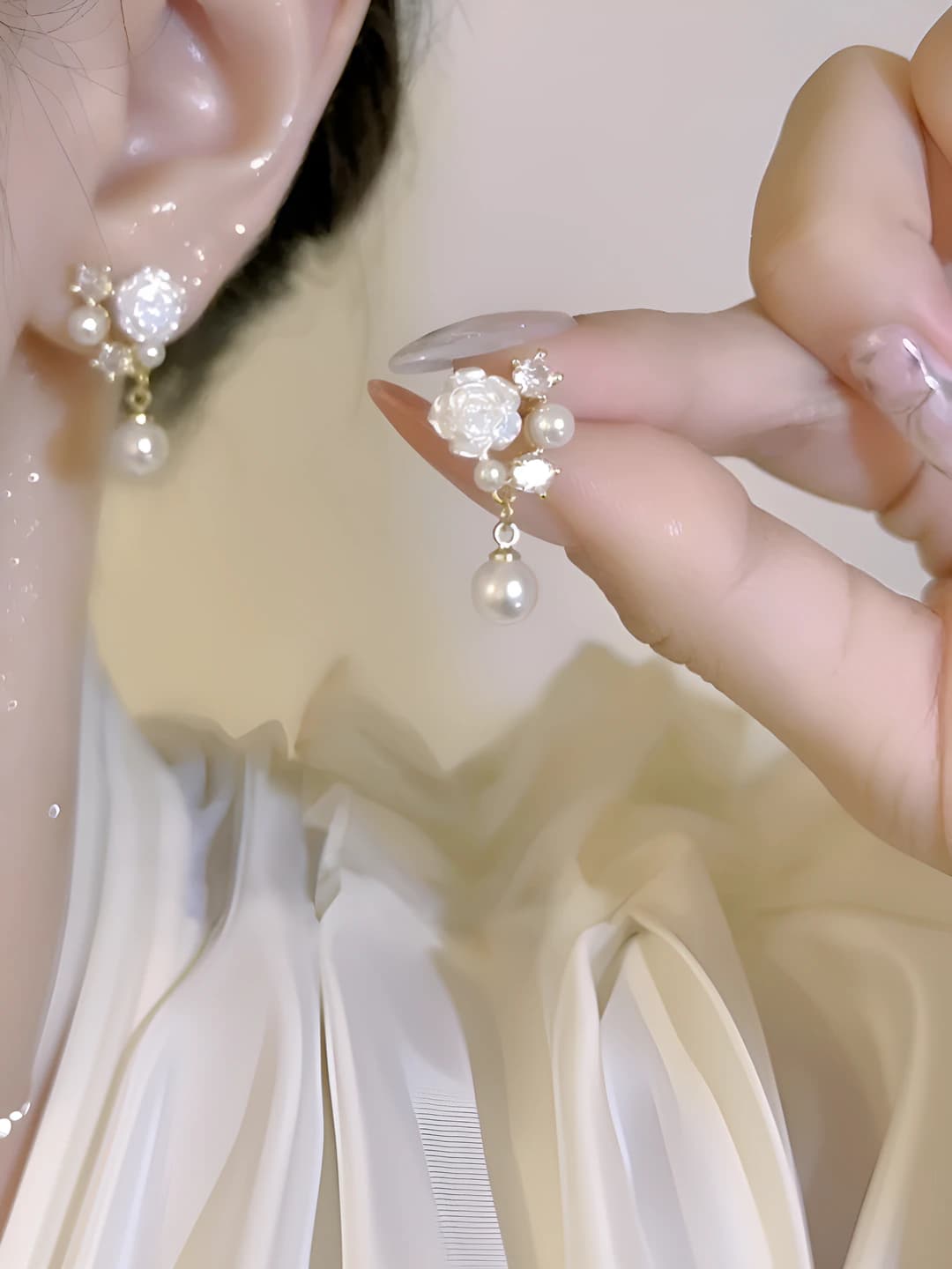 Iridescent camellia, zircon, pearl