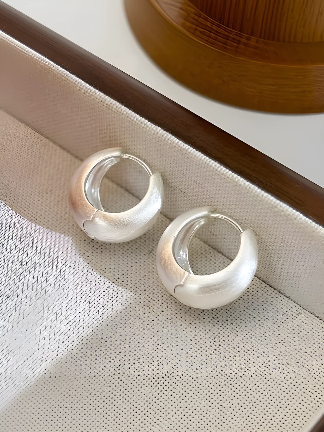 Women's geometric hoop earrings made of copper with a brushed finish and ins style design