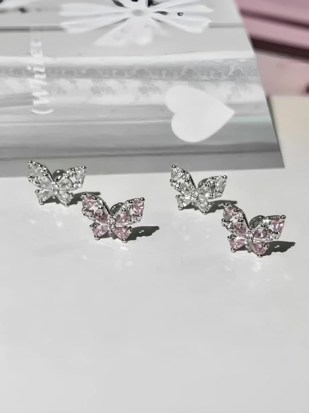 Women's butterfly stud earrings in 316L titanium steel with white and pink cubic zirconia