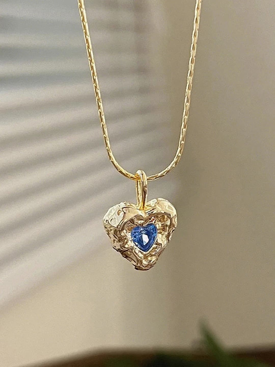 Gold pleated heart necklace 0111