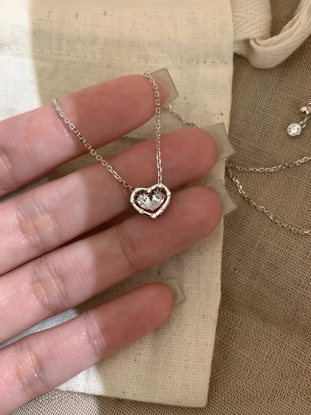 Silver heart knot necklace