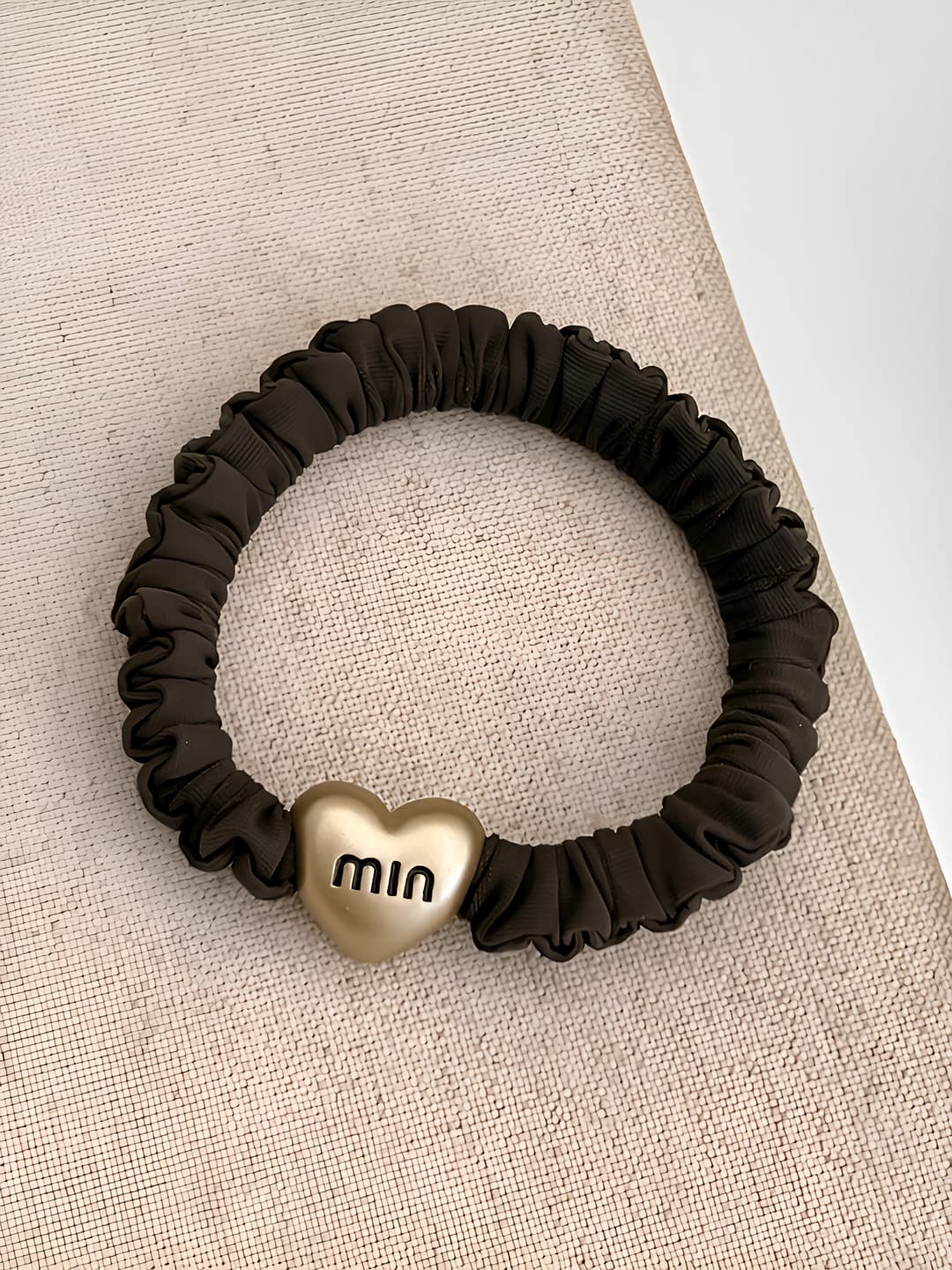 Brown letter hair tie