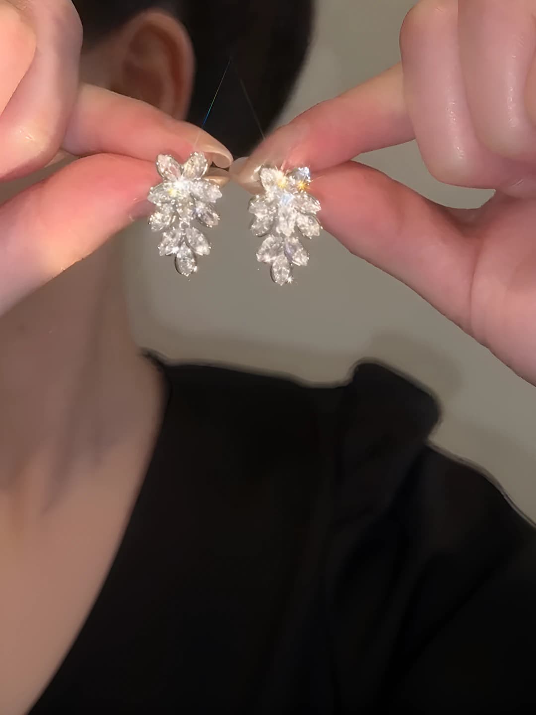 Women's silver post earrings with zircon flower design