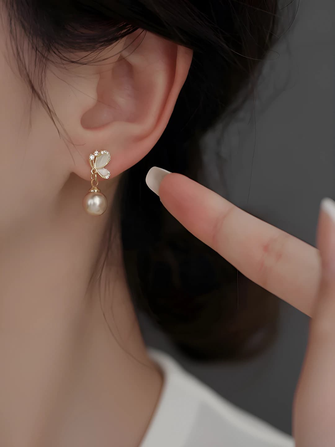 Women's short French style stud earrings with imitation pearl and zircon butterfly design